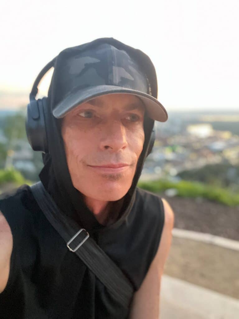 Dizzy wearing headphones and a camo hat at Memorial Park Overlook in Red Wing, Minnesota