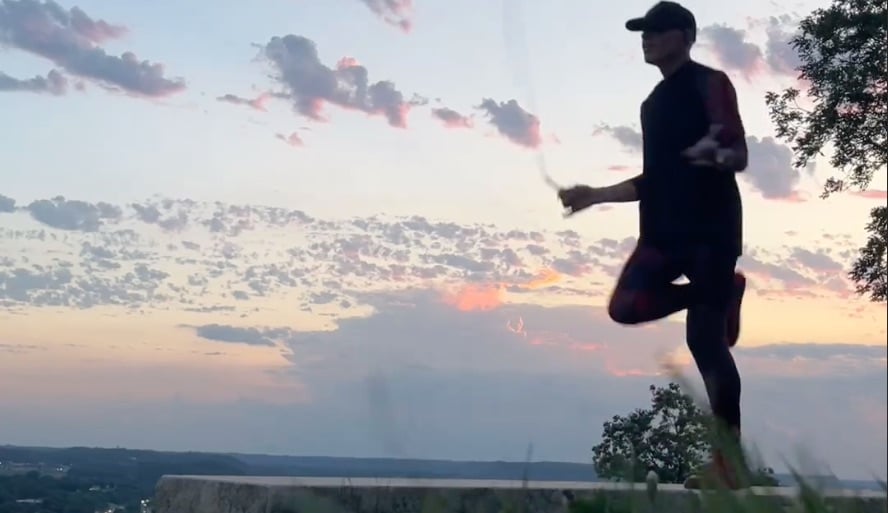 Dizzy skips on a limestone bench at Memorial Park, overlooking Red Wing, Minnesota